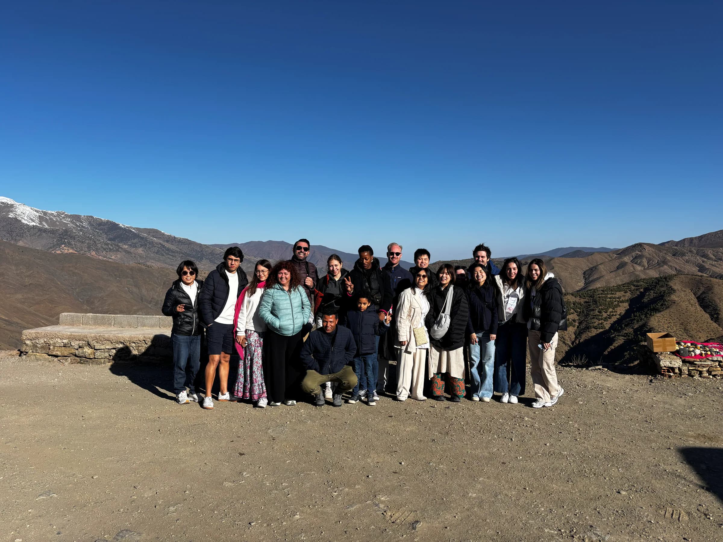 Travelers sharing a group stop in Morocco's Atlas region